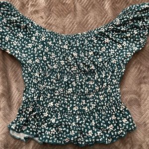 A teal floral blouse